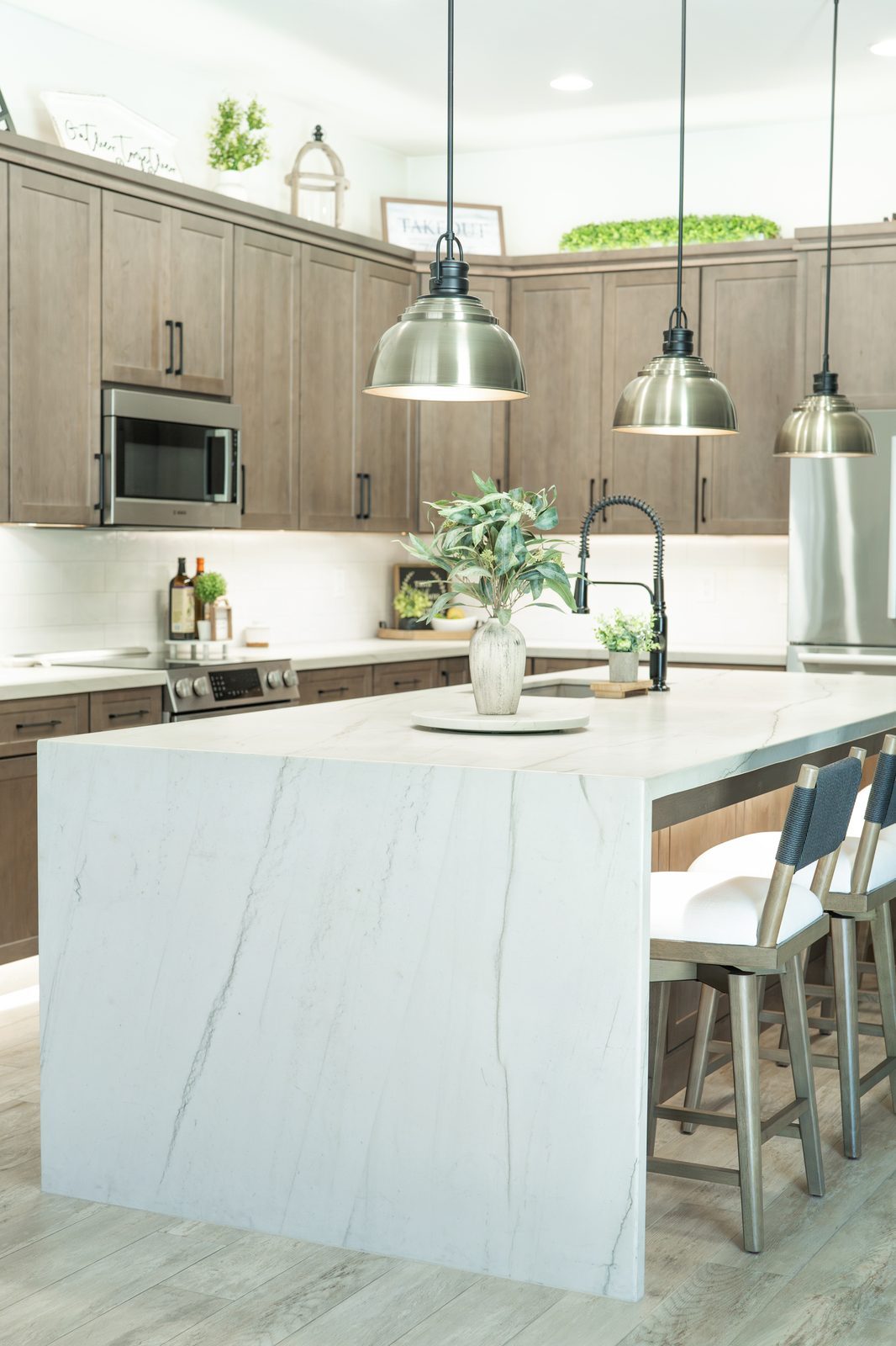 Quartz waterfall countertop on a kitchen island installed by Markell Designs in Gilbert, AZ