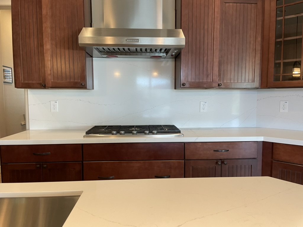 Cooktop and full-height quartz backsplash detail, Chandler, AZ kitchen