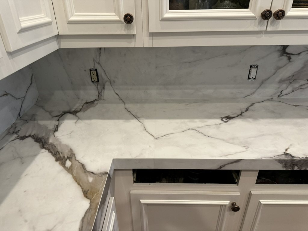 Full-height quartz slab backsplash matched to the countertop veining, Ahwatukee, AZ