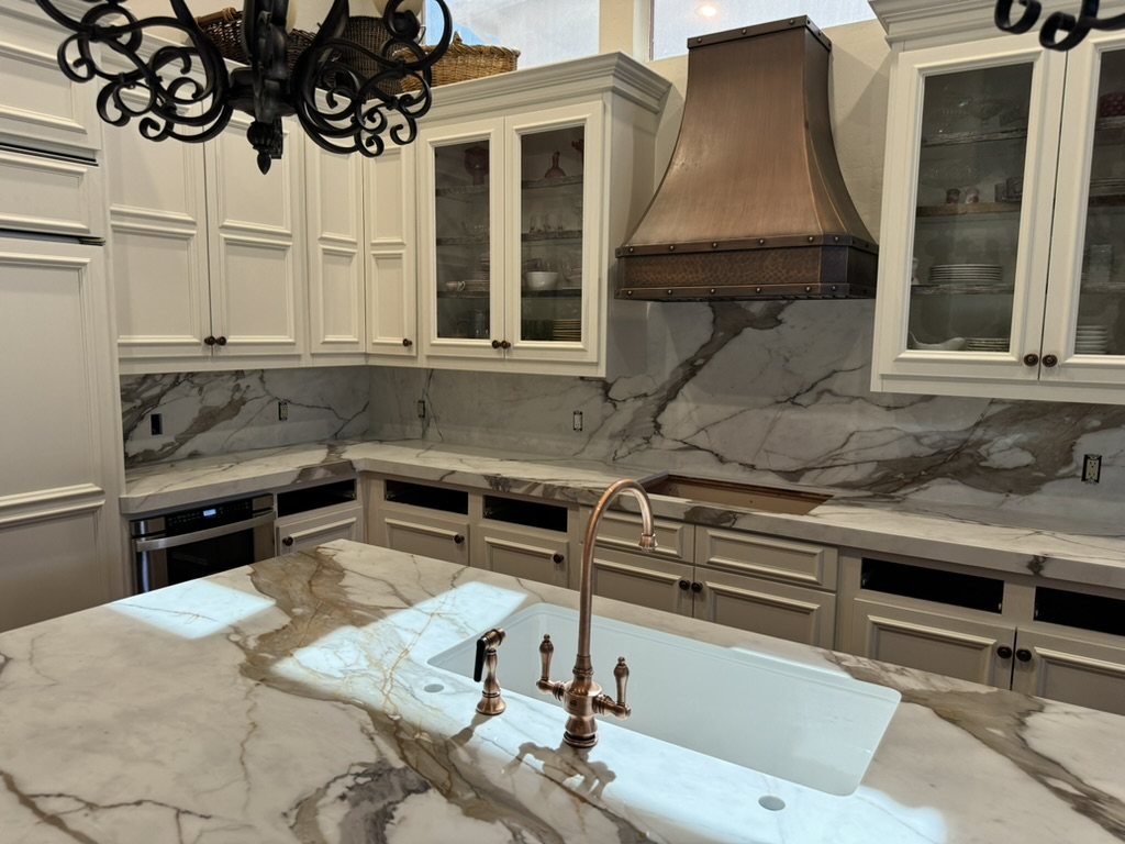 Close view of the quartz island top, undermount sink and copper faucet, Ahwatukee, AZ