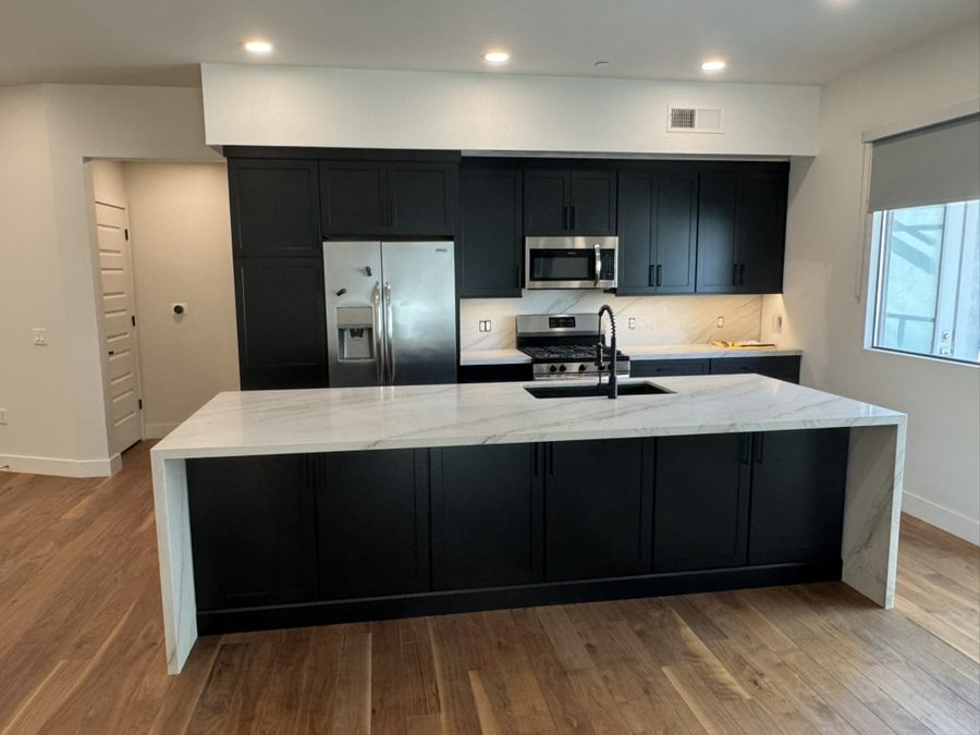Modern matte black shaker cabinetry with quartz waterfall island, Scottsdale, AZ