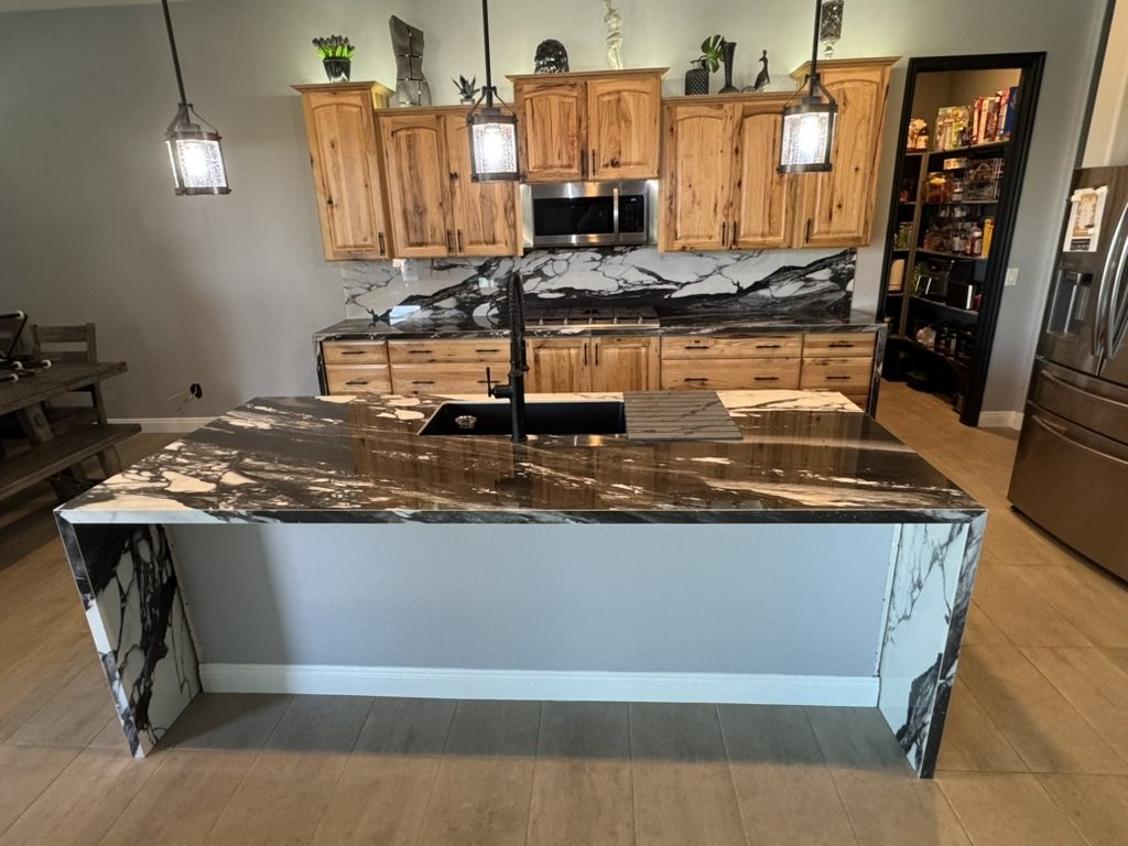 Porcelain waterfall island and full-height backsplash in a San Tan Valley, AZ kitchen