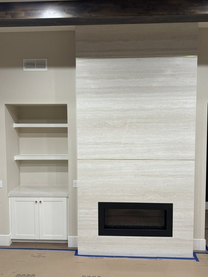 Floor-to-ceiling porcelain fireplace surround with built-in shelving and a porcelain top, Fountain Hills, AZ